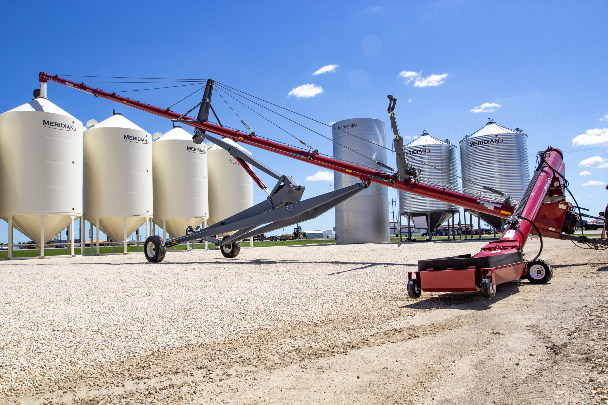 Meridian Swing Augers moving grain from truck to bin
